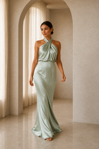 Pale sage asymmetric draped halter A-line evening gown walking view
