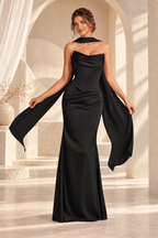 Front view of the black strapless draped floor-length evening gown