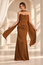 Front view of the caramel strapless draped floor-length evening gown