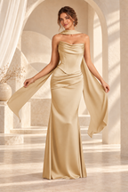 Front view of the champagne strapless draped floor-length evening gown