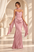 Front view of the dusty rose strapless draped floor-length evening gown