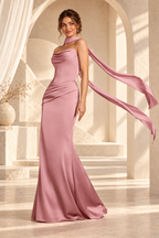 Side view of the dusty rose strapless draped floor-length evening gown