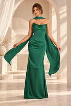Front view of the emerald green strapless draped floor-length evening gown
