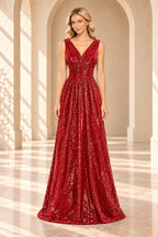 Front view of a red sequin evening gown with a crossover V-neck, ruched waist, and floor-length A-line skirt.