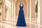 Full-length front view of a royal blue sequin A-line evening gown with a crossover V-neck and ruched waist in a warm ivory stone arcade.