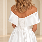 White off-shoulder dress back detail showing a lace-up panel and waist seam