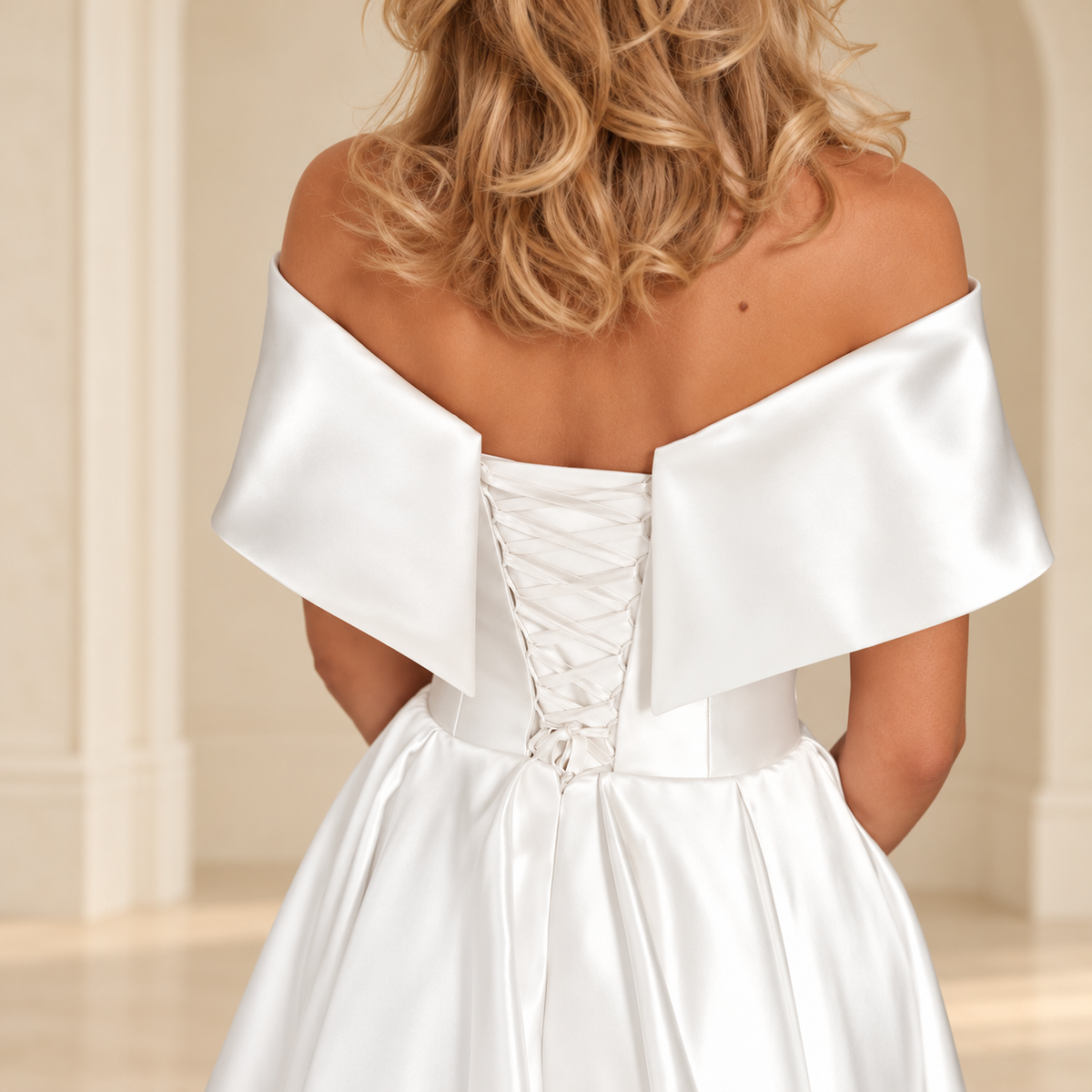 White off-shoulder dress back detail showing a lace-up panel and waist seam