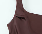 Close-up of the chocolate brown gown neckline and strap