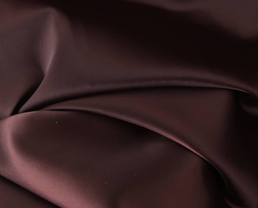 Close-up of the chocolate brown gown fabric folds and texture