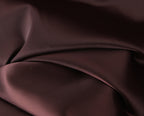 Close-up of the chocolate brown gown fabric folds and texture