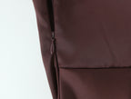 Close-up of a zipper and seam on the chocolate brown gown