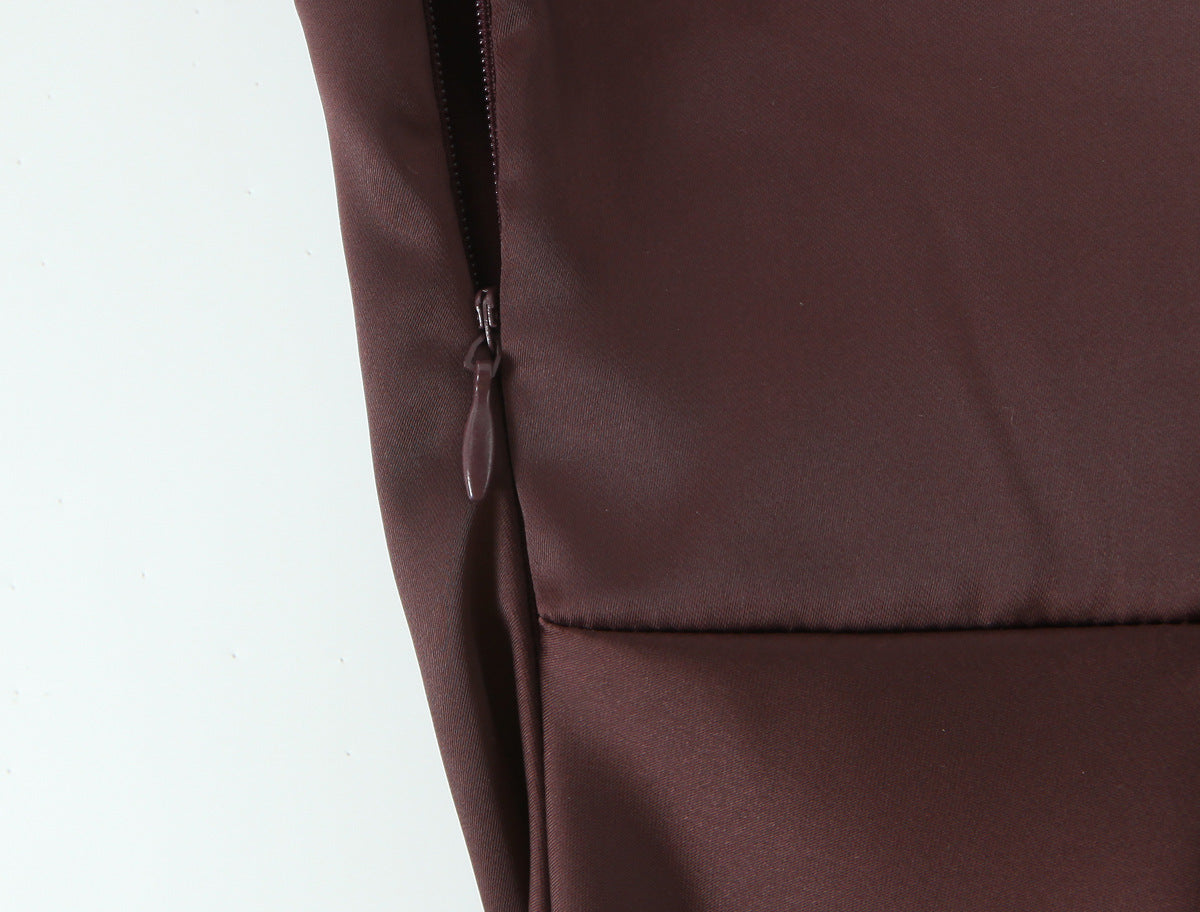 Close-up of a zipper and seam on the chocolate brown gown