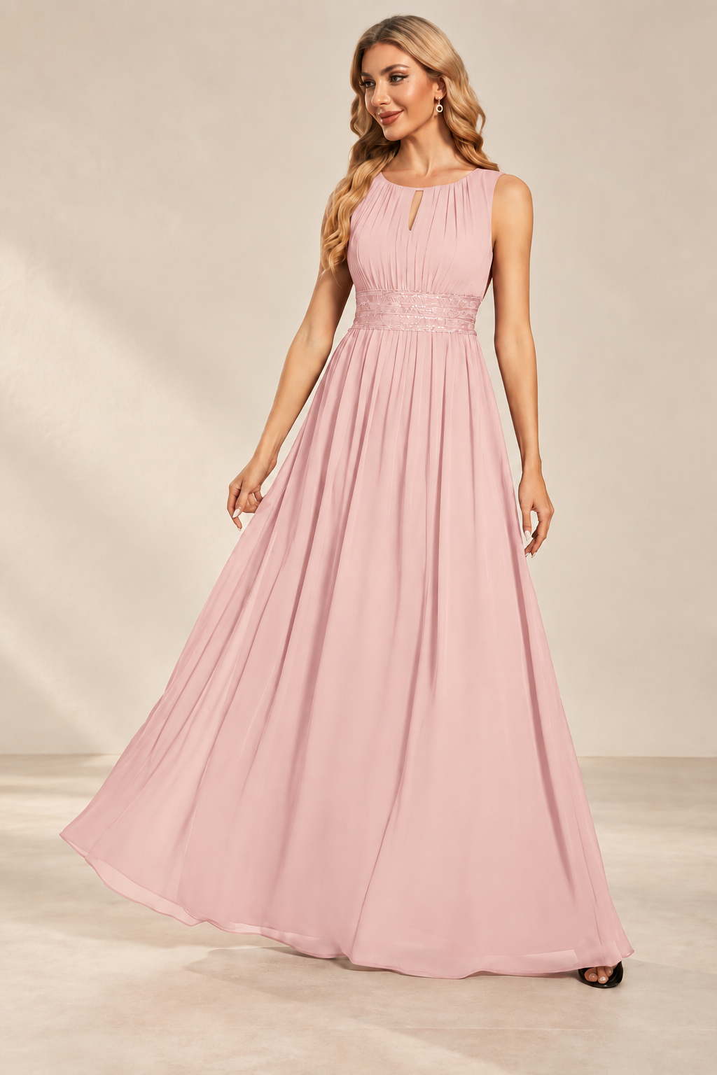Model wearing the blush pink keyhole neck pleated A-line evening gown, front view.