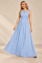 Model wearing the ice blue keyhole neck pleated A-line evening gown, front view.