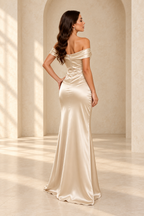 Back view of a champagne off-shoulder satin gown showing the center-back zipper and fitted waist
