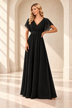 Black A-line evening gown with a pleated crossover V-neck, flutter sleeves and a floor-length skirt.