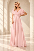 Blush pink A-line evening gown with a pleated crossover V-neck, flutter sleeves and a floor-length skirt.
