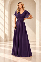Deep purple A-line evening gown with a pleated crossover V-neck, flutter sleeves and a floor-length skirt.