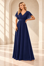 Navy A-line evening gown with a pleated crossover V-neck, flutter sleeves and a floor-length skirt.